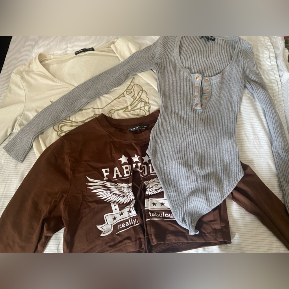 2 graphic long sleeve crop tops & a long sleeve ribbed body suit.